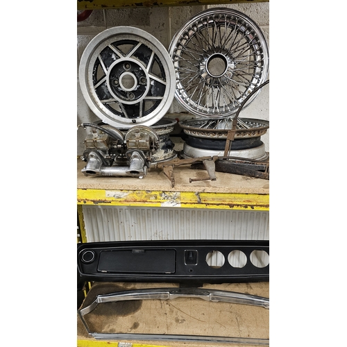 223 - Two Stag alloy wheels, two splined wire wheels, a Morris/Austin dash and grill surround, a pair of S... 