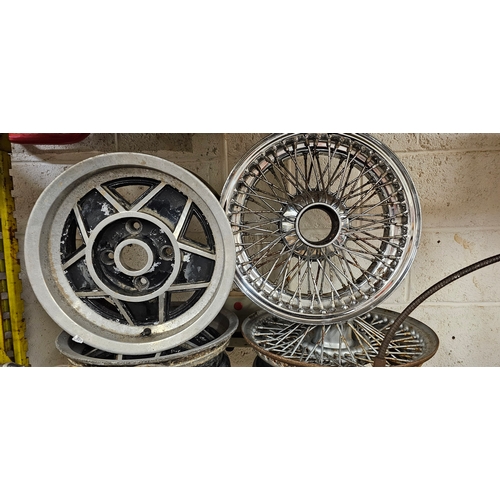 223 - Two Stag alloy wheels, two splined wire wheels, a Morris/Austin dash and grill surround, a pair of S... 