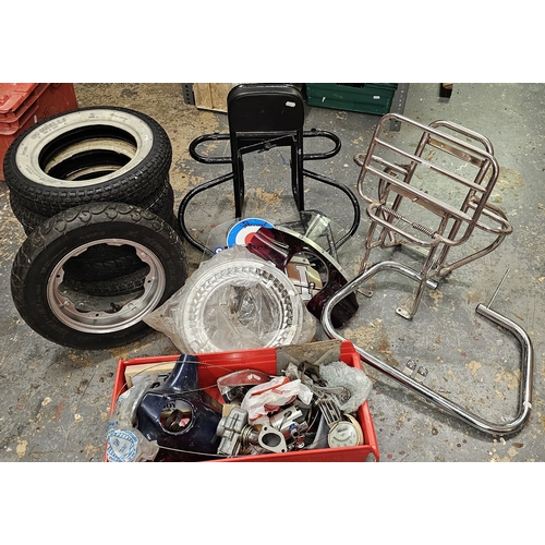 349 - A collection of Lambretta parts to include a chrome wheel/luggage rack