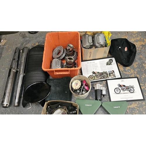 358 - A collection of Moto Guzzi 750 spares, including a NOS starter motor, cylinder heads, cam covers and... 