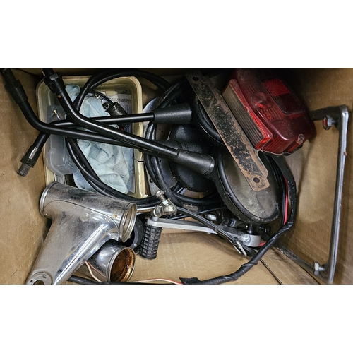 358 - A collection of Moto Guzzi 750 spares, including a NOS starter motor, cylinder heads, cam covers and... 