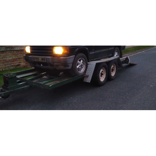 395 - A heavy duty twin axle car trailer with ramps and winch, Knott Avonride 1800 kgs axles with the larg... 