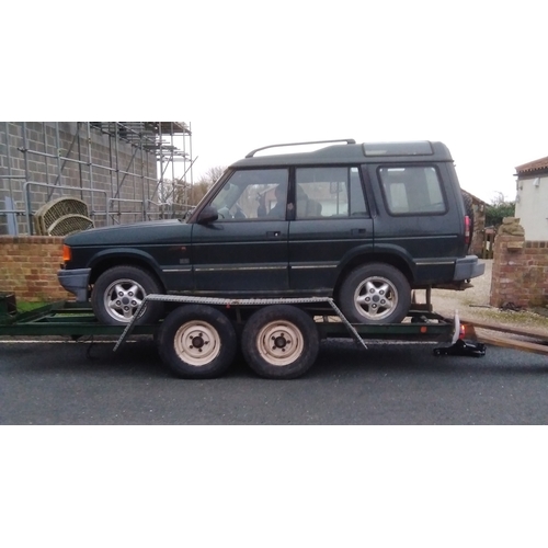 395 - A heavy duty twin axle car trailer with ramps and winch, Knott Avonride 1800 kgs axles with the larg... 