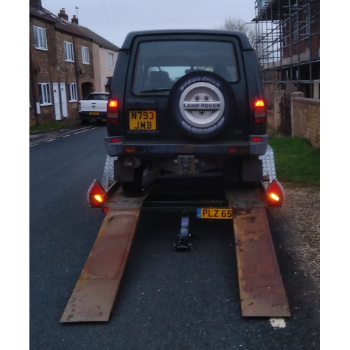 395 - A heavy duty twin axle car trailer with ramps and winch, Knott Avonride 1800 kgs axles with the larg... 