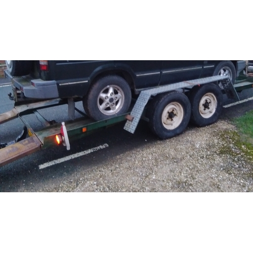 395 - A heavy duty twin axle car trailer with ramps and winch, Knott Avonride 1800 kgs axles with the larg... 