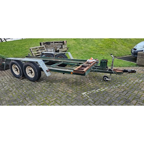 395 - A heavy duty twin axle car trailer with ramps and winch, Knott Avonride 1800 kgs axles with the larg... 