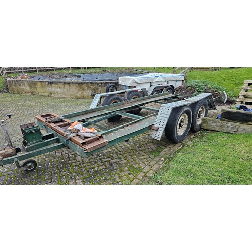 395 - A heavy duty twin axle car trailer with ramps and winch, Knott Avonride 1800 kgs axles with the larg... 