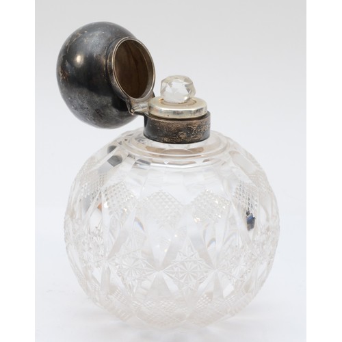 64 - A George V silver topped cut glass dressing table bottle, Chester 1923.