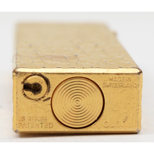 99 - Dunhill, a gold plated rectangular gas lighter, US.RE24163, 6.5 x 2.5cm.