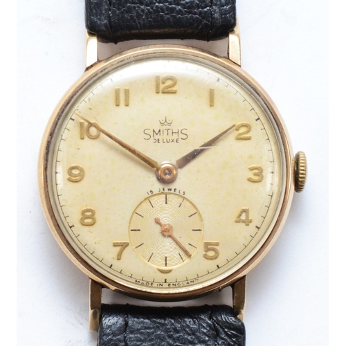 115 - Smiths De Luxe, a 9ct gold cased Gentleman's wrist watch, the dial set with Arabic numerals and seco... 