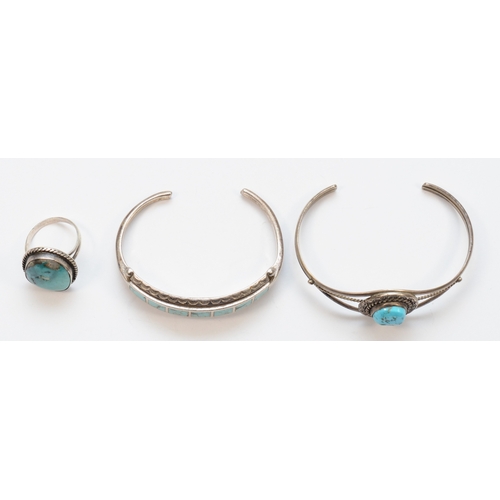 198 - Two silver native American turquoise bracelets, unmarked, and a silver turquoise free form ring, 40g... 