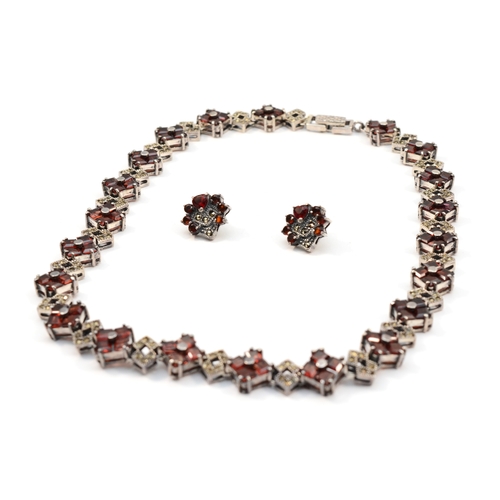 199 - A silver garnet and marcasite necklace, with matching earrings, 42cm, 65gm.