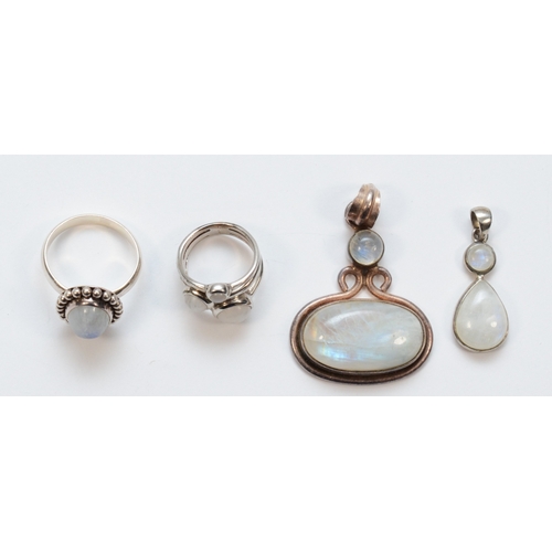 205 - Two silver moonstone rings and two silver moonstone drop pendants, largest 50 x 33mm, 34gm.