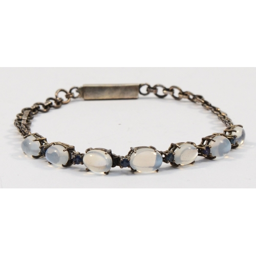 206 - A silver moonstone and sapphire bracelet, unmarked, 20cm, 6gm.