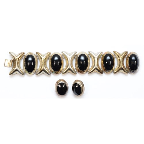 213 - A Mexican silver black hard stone bracelet and matching earrings, by Taxco, 19.5cm, 113gm.