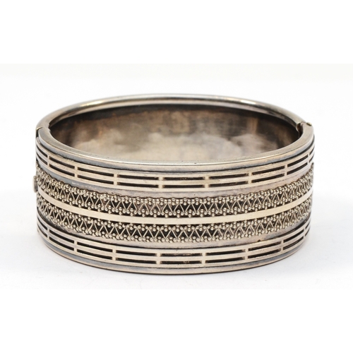 214 - A Victorian silver hinged bangle, unmarked, with bead and wire decoration, 55mm, 35gm.