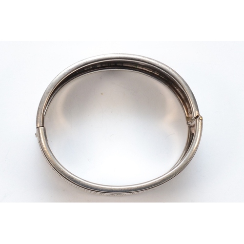 214 - A Victorian silver hinged bangle, unmarked, with bead and wire decoration, 55mm, 35gm.