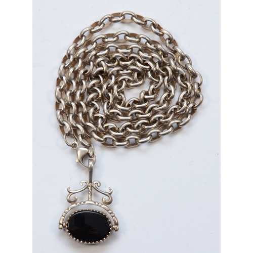 221 - A vintage silver tigers eye and onyx swivel fob, on a silver chain, 35 x 25mm, 46gm.