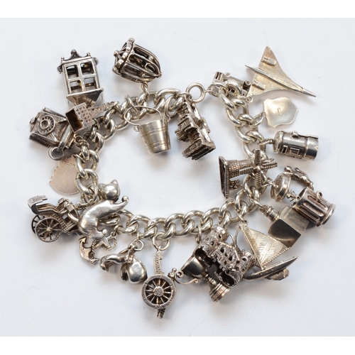 224 - A silver charm bracelet with charms, lacking clasp, to include a Concord plane example, 131gm.