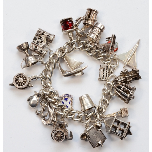 224 - A silver charm bracelet with charms, lacking clasp, to include a Concord plane example, 131gm.