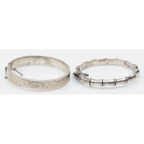 227 - A vintage silver bamboo hinged bangle, and another chased decorated example, Birmingham 1967, 26gm.