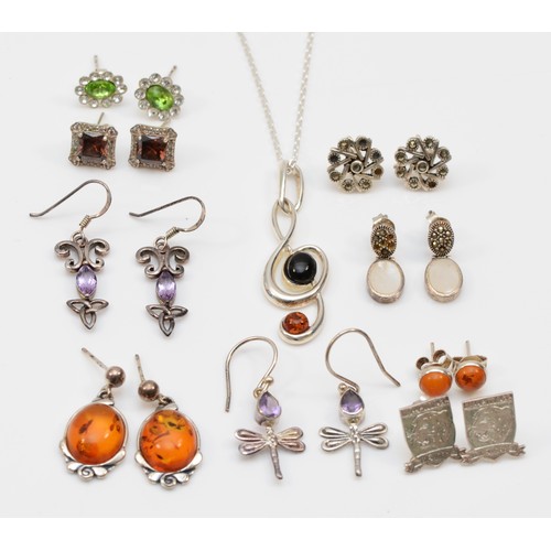 229 - Nine pairs of silver earrings to include a pair of Baltic amber drop earrings, 27mm, together with a... 