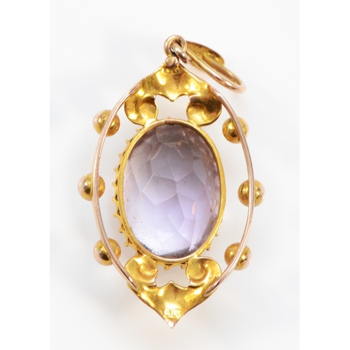 237 - An Edwardian gold amethyst and seed pearl openwork pendant, unmarked, 35mm, 2.8gm.