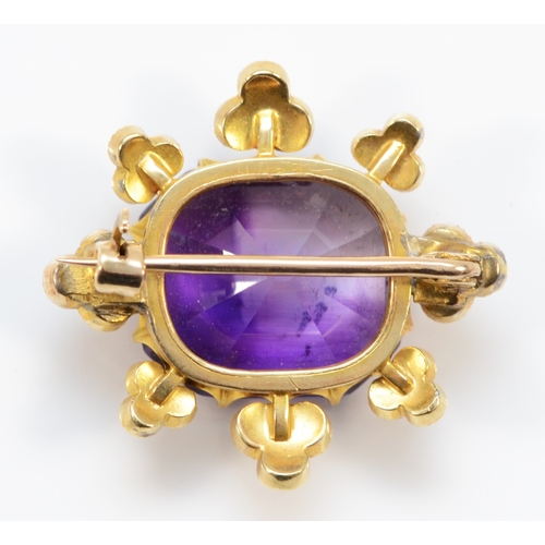 238 - An Edwardian gold amethyst and seed pearl floral brooch, unmarked, 26mm, 6.9gm.