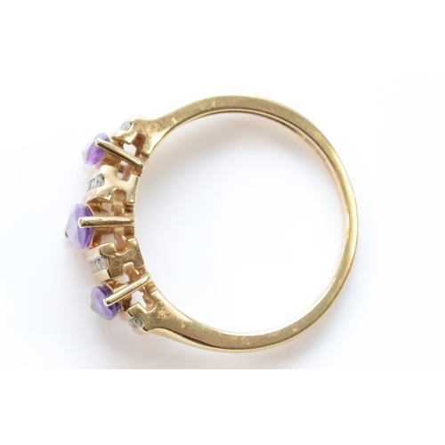 242 - A 9ct gold three stone amethyst and eight cut diamond dress ring, R, 2.8gm.