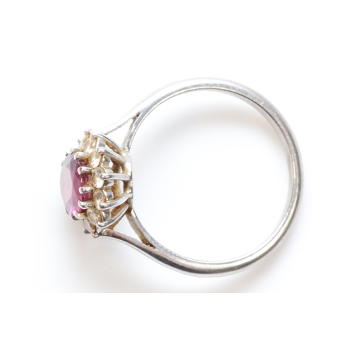 271 - A white gold ruby and diamond cluster ring, L, 3.3gm.