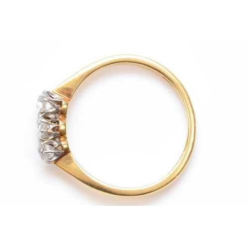 282 - An 18ct gold three stone old cut diamond dress ring, O, 2.2gm.