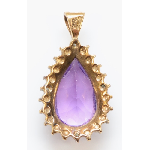 286 - A 9ct gold amethyst and illusion set diamond pendent, 23 x 13mm, 2.5gm.