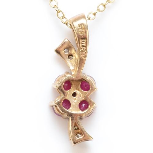 289 - A 9ct gold ruby and eight cut diamond pendant, on 9ct gold chain, 20mm, 2.4gm.