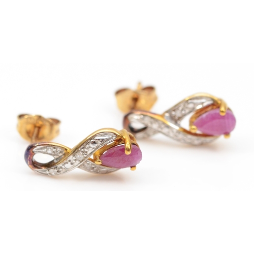 293 - A pair of 9ct gold ruby and eight cut diamond drop earrings, 13mm, 1.3gm.