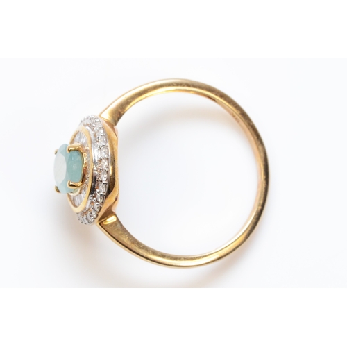 301 - A 9ct gold aquamarine and diamond cluster ring, with baguette and brilliant cut diamonds, T, 3gm.