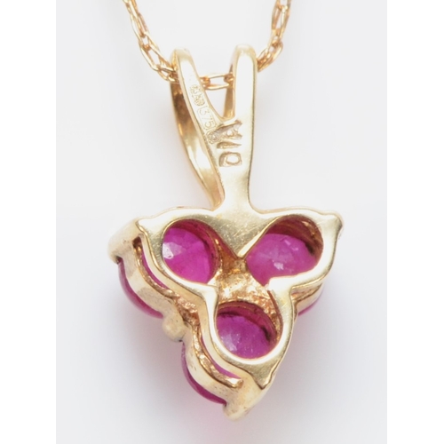 306 - A 9ct gold ruby and eight cut diamond pendant, on a 375 gold chain, 11mm, .8gm.