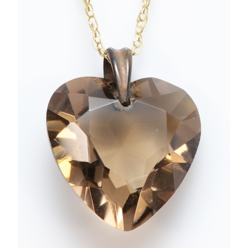 A heart cut smokey quartz on 375 gold chain, 20 x 17mm, 3.7gm.
