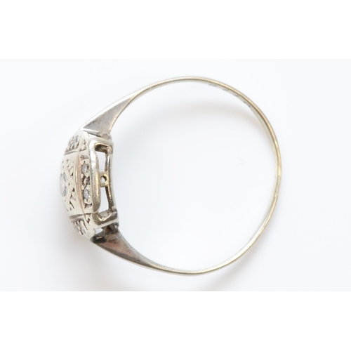 318 - A 9ct white gold eight cut diamond dress ring, P, 1.4gm.