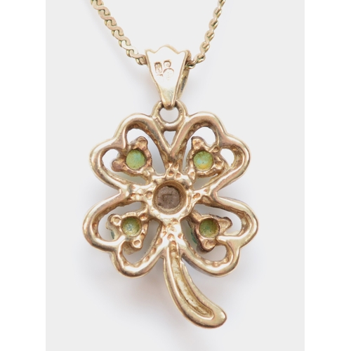 342 - A 9ct gold emerald and eight cut diamond clover pendant, on 9k gold chain, 16mm, 1.8gm.