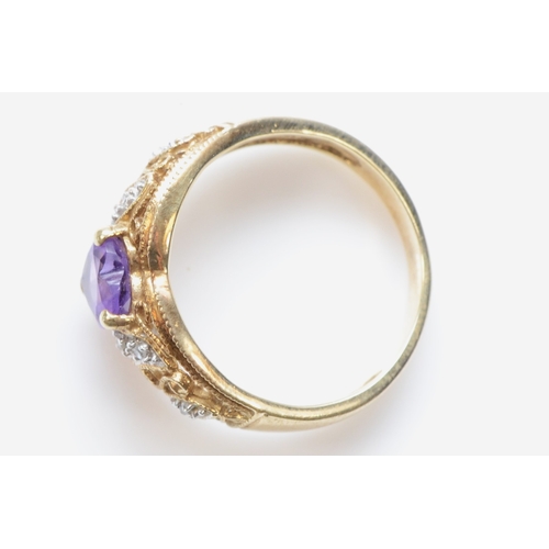 344 - A 9ct gold heart cut amethyst and diamond dress ring, M, 3.5gm.