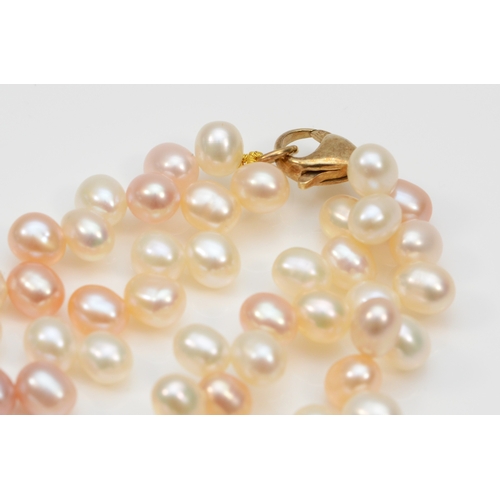 374 - a 375 gold clasped baroque pearl necklace, 6mm pearls, 47cm.