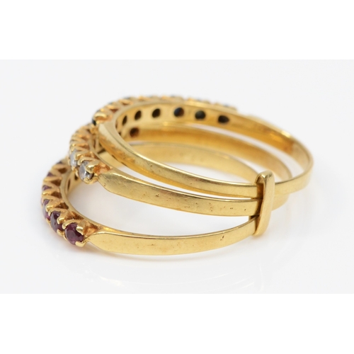 380 - A gold three stacking ring set with ruby, brilliant cut diamond and sapphire, with Continental duty ... 