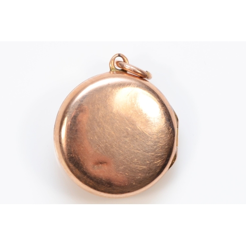 394 - A 9ct gold front and back sead pearl circular locket, 15mm, 2.1gm.