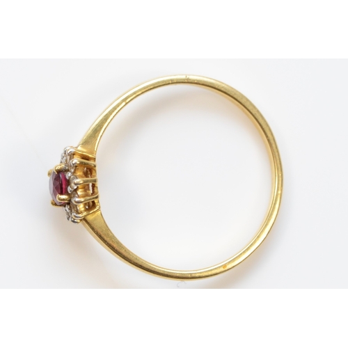 395 - A 750 gold synthetic ruby and diamond cluster ring, N, 2gm.