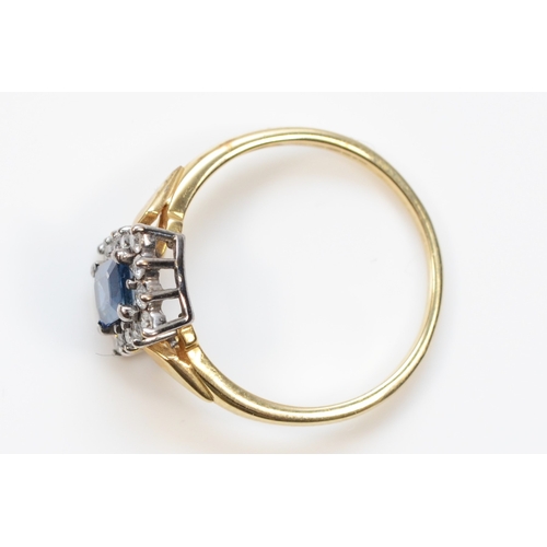 401 - A 9ct gold synthetic sapphire and brilliant cut diamond dress ring, P, 2gm.