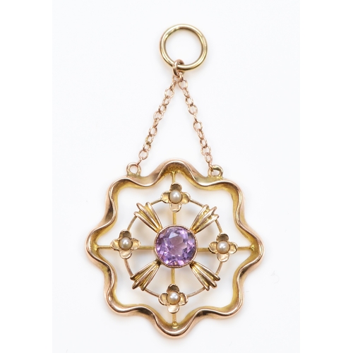 409 - An Edwardian 9ct gold amethyst and seed pearl open work drop pendant, 45 x 25mm, 2gm.