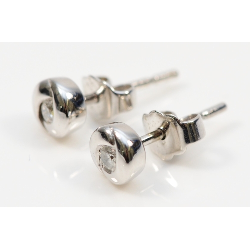 411 - A pair of 9k white gold brilliant cut diamond stud earrings, 4mm, 1gm.