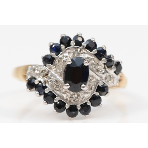 418 - A 9ct gold sapphire and eight cut diamond cluster ring, P, 2.8gm.