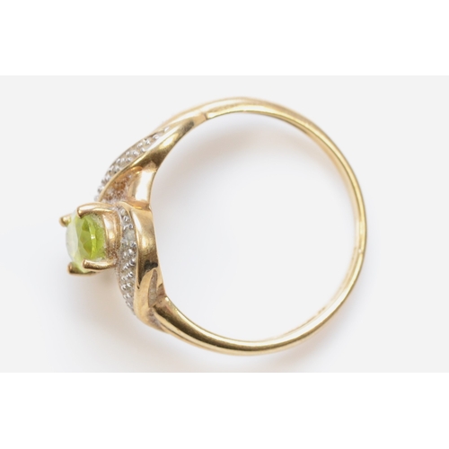 436 - A 9ct gold peridot and eight cut diamond dress ring, O-P, 2.4gm.