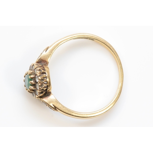 439 - A 9ct gold emerald and brilliant cut diamond dress ring, O-P, 2.3gm.